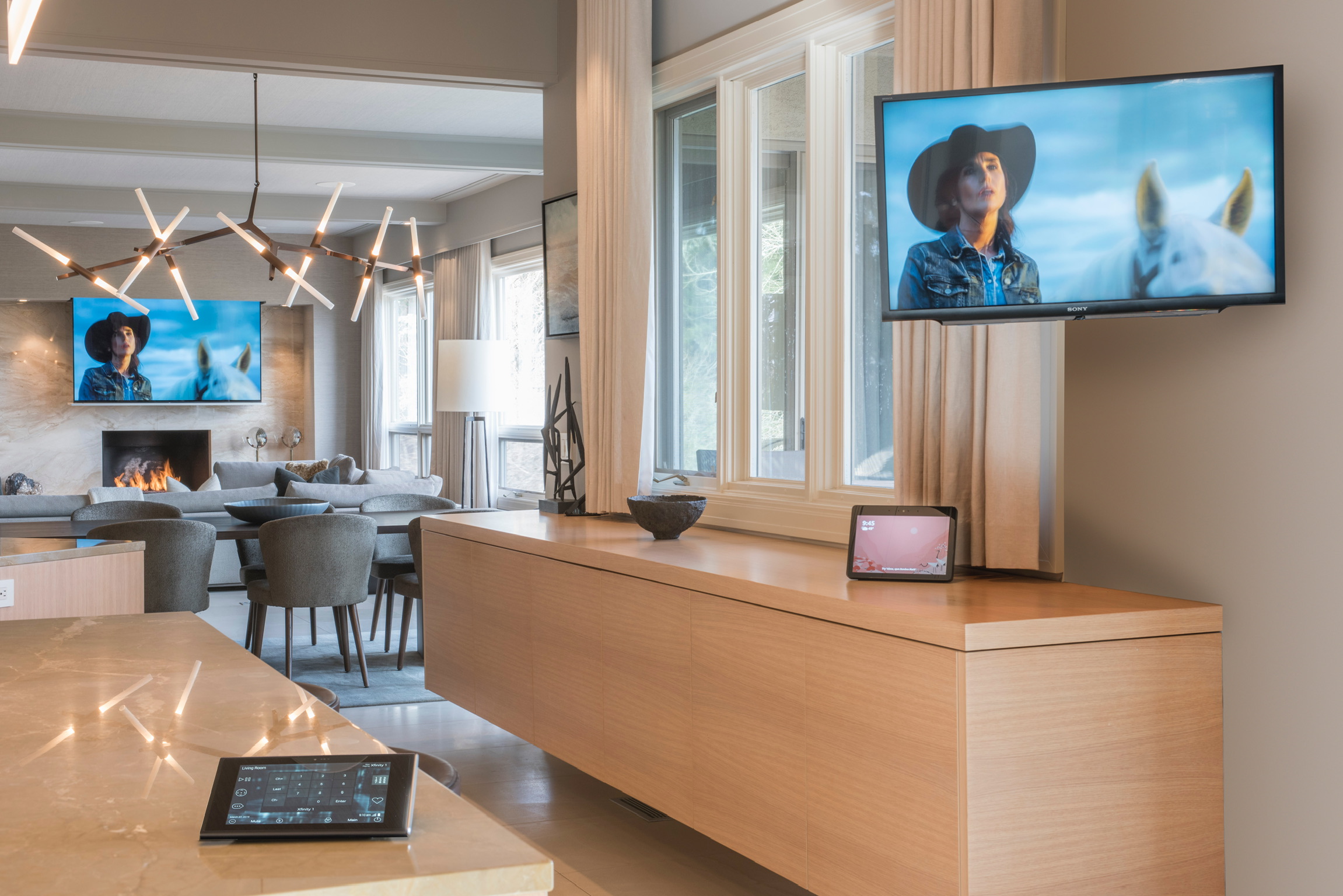 Luxury living room with integrated TVs and smart-home control